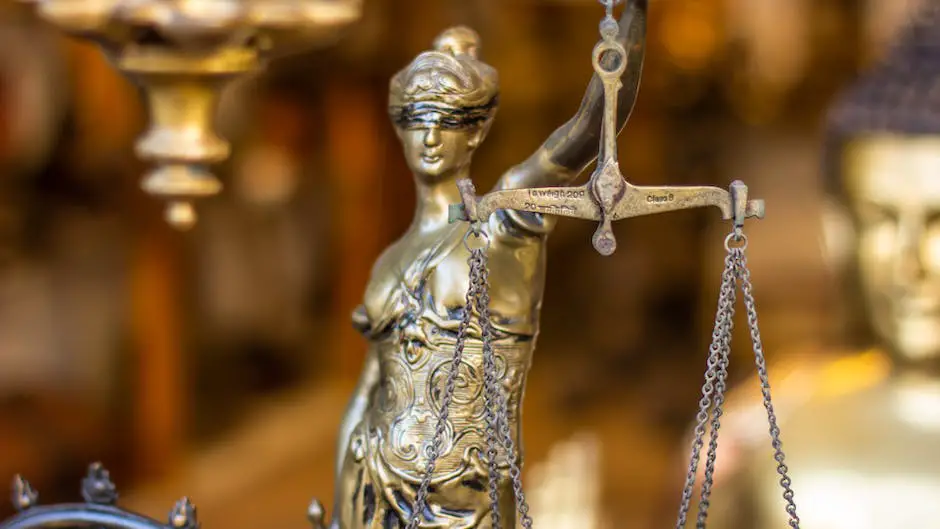 An image depicting a lawyer holding scales of justice, symbolizing justice and compensation for catastrophic injury cases.